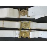 Three white parade belts with brass buck