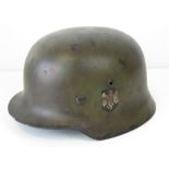 A WWII German helmet, later painted and