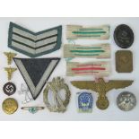 An assortment of WWII German cloth and m