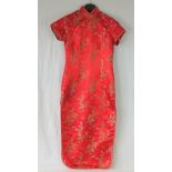 A Chinese red silk dress, size 38, embroidered dragon design.