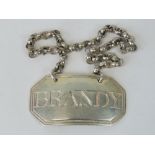 A Georgian HM silver 'Brandy' decanter tag of octagonal form, complete with chain,