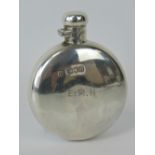 A HM silver miniature hip flask of round form with hinged lid, hallmarked London 1987, 1.6ozt.