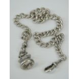 A HM silver Albert chain complete with lobster clasps and seal fob depicting a dragons head over a