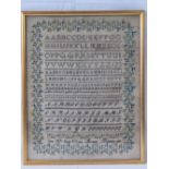 An early 19th century woven sampler depicting the alphabet in various fonts and sewn under 'June