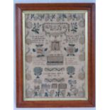 A 20th century needlework sampler decorated with flowers and pears upon,
