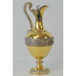 A large and impressive gilded HM silver Victorian lidded ewer or claret jug,