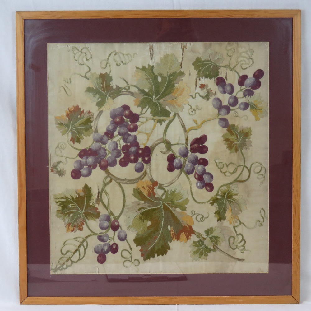 A hand embroidered needlework panel depicting a vine and bunches of grapes upon, 19th century, a/f,