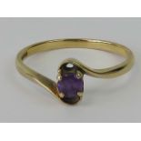 A 9ct gold and amethyst ring, round cut