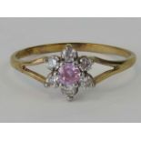 A 9ct gold ring with pink and white ston