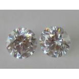 Two round cut white CZ stones, each 5.2m