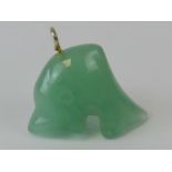 A jade pendant in the form of a dolphin,