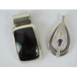 Two silver pendants; one of rectangular