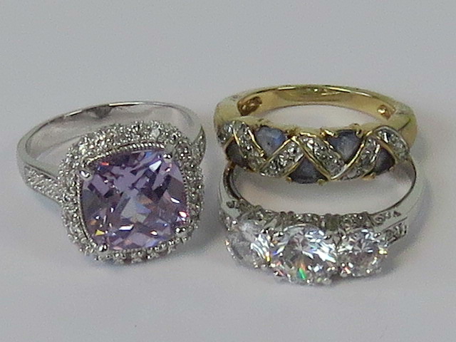 Three costume jewellery rings.