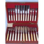 A wooden canteen of cutlery comprising, salad forks,