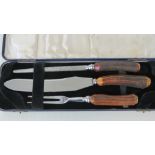 A Thomas and Co Sheffield made horn handled carving set in presentation box.