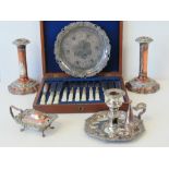 A Victorian Sheffield plate chamber candlestick, with EPBM scroll and fruiting vine border,