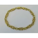 A 9ct gold fancy Celtic link bracelet, hallmarked 375,18.5cm in length, 8g.