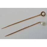 Two rose metal tie or stick pins,