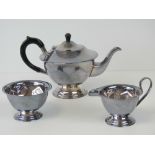 A silver plated Art Deco tea service comprising; teapot, cream jug and sugar bowl.