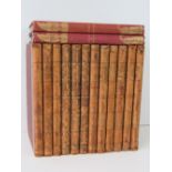 Twelve volumes of half leather bound Punch volumes, 1841, 1842 (x2, 1843 (x2), 1844 (x2), 1845 (x2),