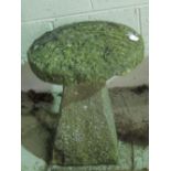 An original antique staddle stone comprising circular top 36cm dia, upon tapering quatreform base,