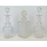 A pair of mallet shaped ring necked decanters, with slice cut bodies and necks,