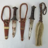 Two hunting knives in leather scabbards a/f, together with a horsehair fly whisk. 3 items.