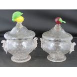 A pair of mottled glass lidded fruit jars, finials in the form of a lemon and a cherry, standing 15.