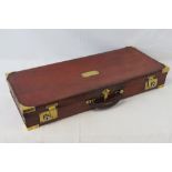 A brown leather square shaped case with blank brass plate,