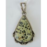 A teardrop shaped dalmatian jasper necklace, silver mount stamped 925, 5.5cm including bale.