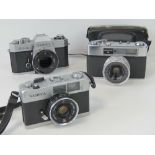 A vintage Yashika 35-E with Yashinon lense, Yashika FX2 SLR camera (lens deficient).