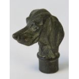 A bronzed walking stick top fashioned as a hunting dogs head, 7cm.