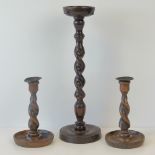 A 1930s stained oak barleytwist smokers receptacle standing 43cm high,