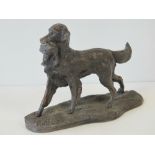 A cold cast bronze Heredities figurine of a gun dog (Retriever)carrying a duck in its mouth,