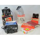 A vintage Polaroid 'Super Colour Swinger II' camera with original box and unopened packet of type