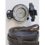 A contemporary Francis Barker M-73 compass with fitted leather case.