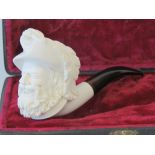 A contemporary cased Meerschaum style pipe in the form of a bearded gentleman with feathered hat,