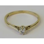 A 9ct gold solitaire ring, round cut diamond claw set in raised gallery, hallmarked 375, size N, 1.