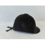 A velvet covered riding hat, size 6 3/4. For decoration only (*not for use).
