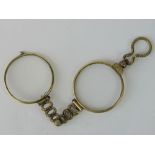 A pair of yellow metal folding lorgnette