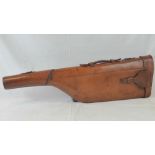 A brown leather leg o'mutton gun case wi