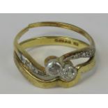 A diamond and gold wedding ring suite,