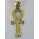 An 18ct gold and diamond Ankh pendant, twelve round cut diamonds set in trios, Arabic hallmarks, 4.