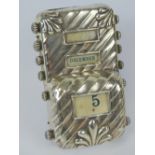 A HM silver perpetual desk calendar, silk scrolls within printed with day,