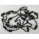 A Victorian Whitby jet long necklace,