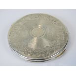 A KIGU HM silver compact, engine turned top with floral engraved border,