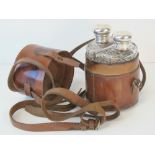 A vintage double hunting flask case complete with original HM silver and cut glass flasks,