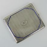 A c1930s German made Silver and enamel cigarette case with oval cut sapphire push button clasp,