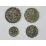 A cased full set of Victorian 'Young Head' Maundy Money dated 1887 (box dated 1877) and comprising