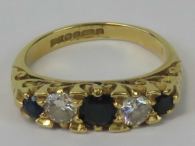 An 18ct gold diamond and sapphire five stone ring,